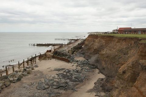Interactive allows the user to slide over two maps to compare the location of some features. Both maps show the North Sea. The left map has an area called Dogger Hills, which becomes “Dogger Island” in the other map. The coastlines of nearby landmasses are also noticeably thinner or farther back.